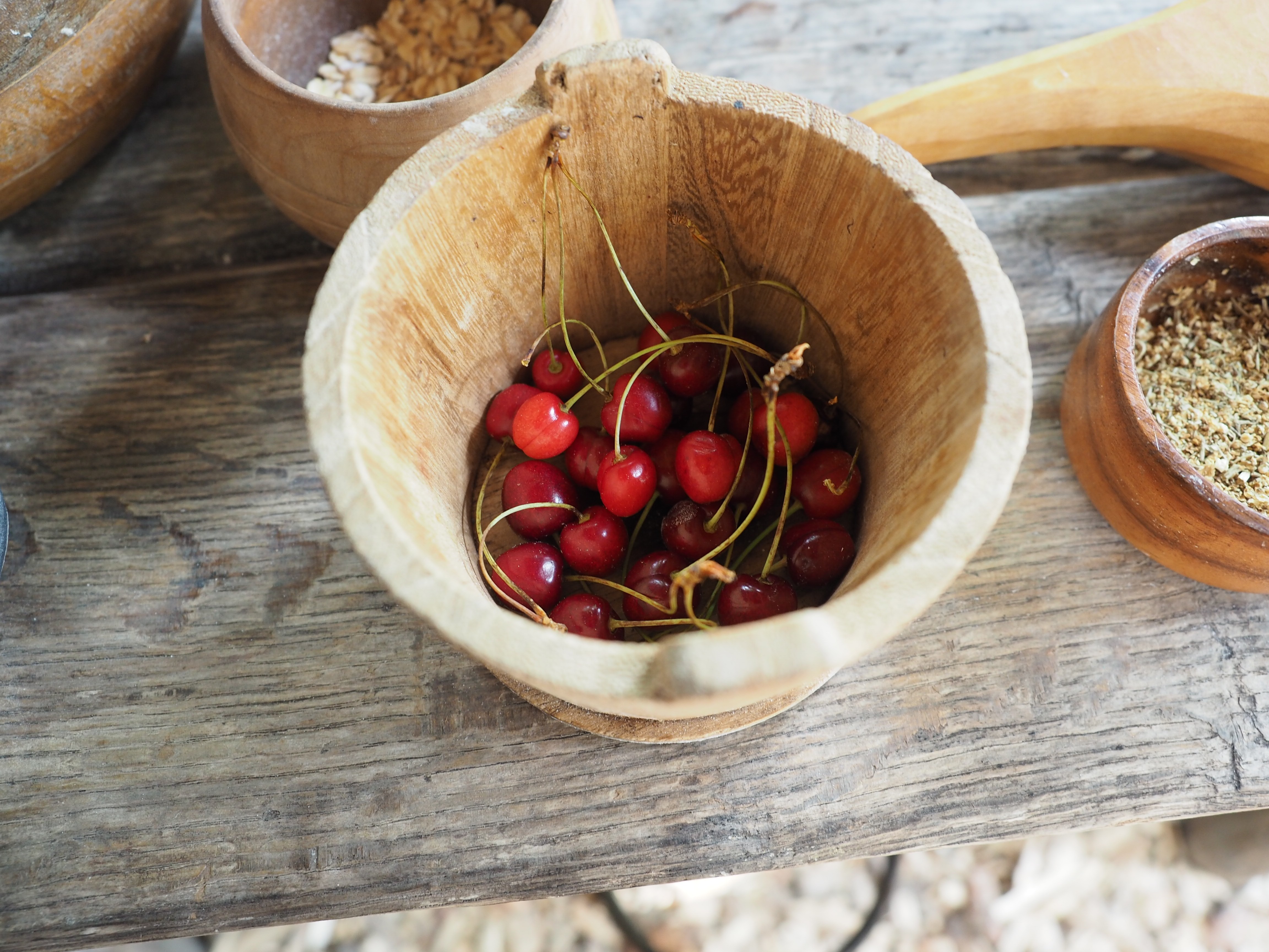 Cherries in a wooden bowl, medieval.
